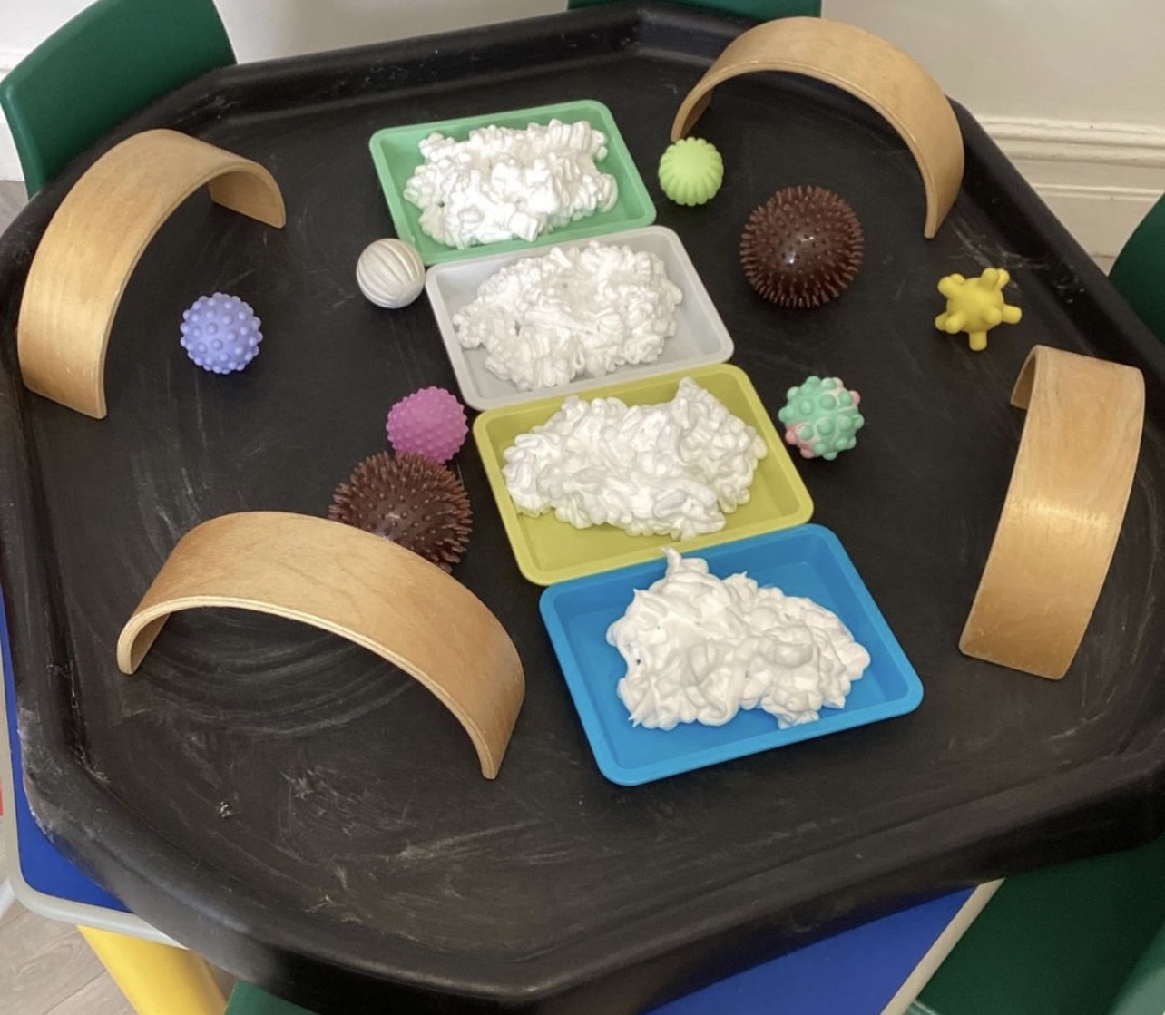 Shaving foam and sensory ball tray play